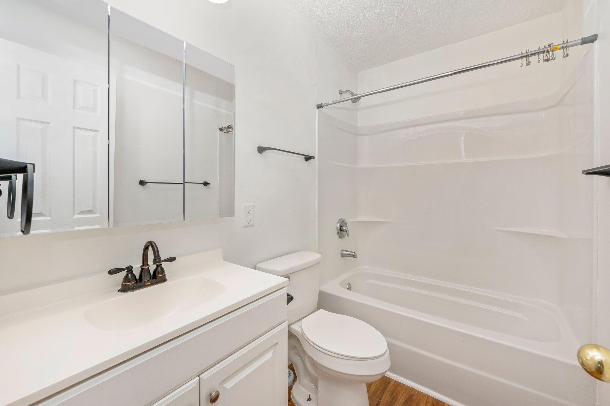 1099 Highway 2 Westville, FL 32464 - Photo 26 of 34 a bathroom with a sink a toilet and a bathtub