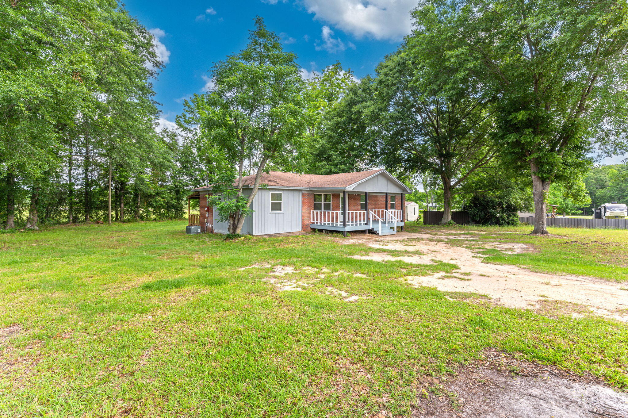 1099 Highway 2 Westville, FL 32464 - Photo 30 of 34 a front view of a house with garden