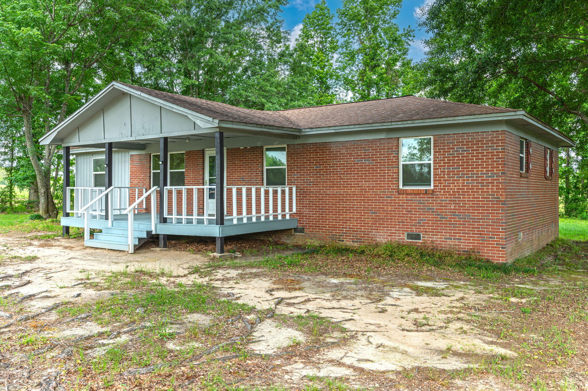 1099 Highway 2 Westville, FL 32464 - Photo 3 of 34 a front view of a house with garden