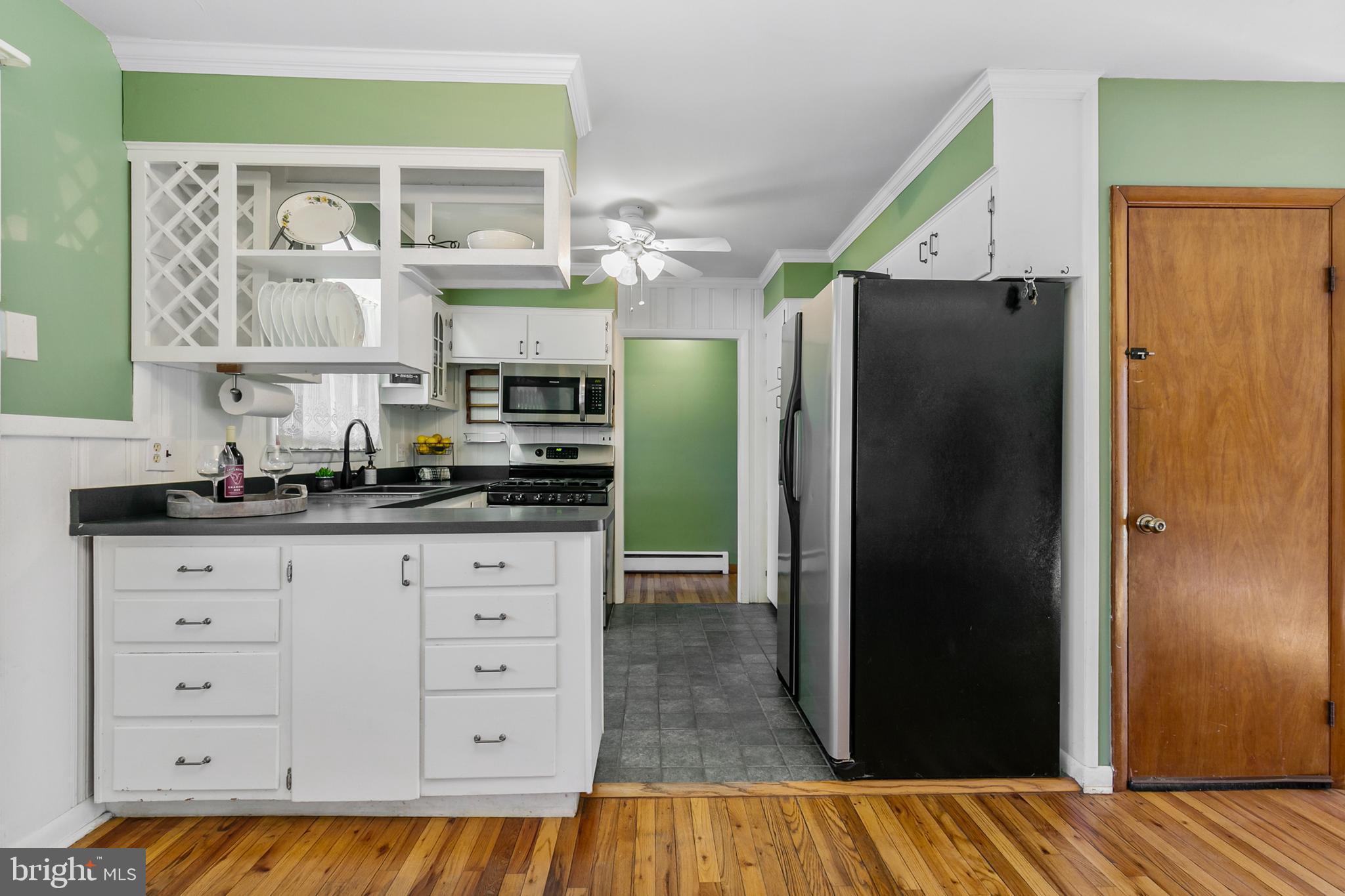 1358 Stokes Road Medford, NJ 08055 - Photo 11 of 36 a kitchen with a refrigerator and a cabinets