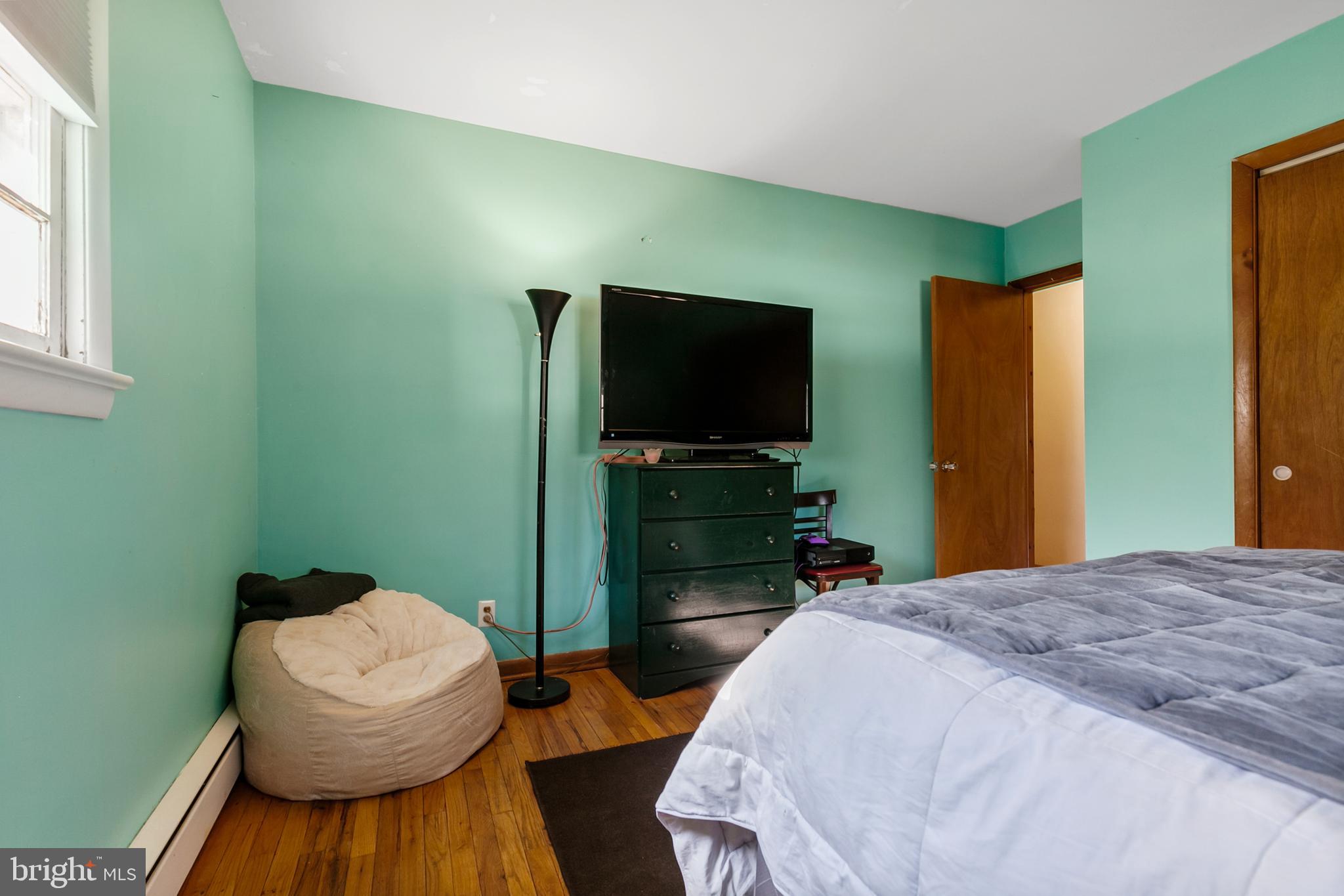 1358 Stokes Road Medford, NJ 08055 - Photo 17 of 36 a bedroom with a bed and a television in it