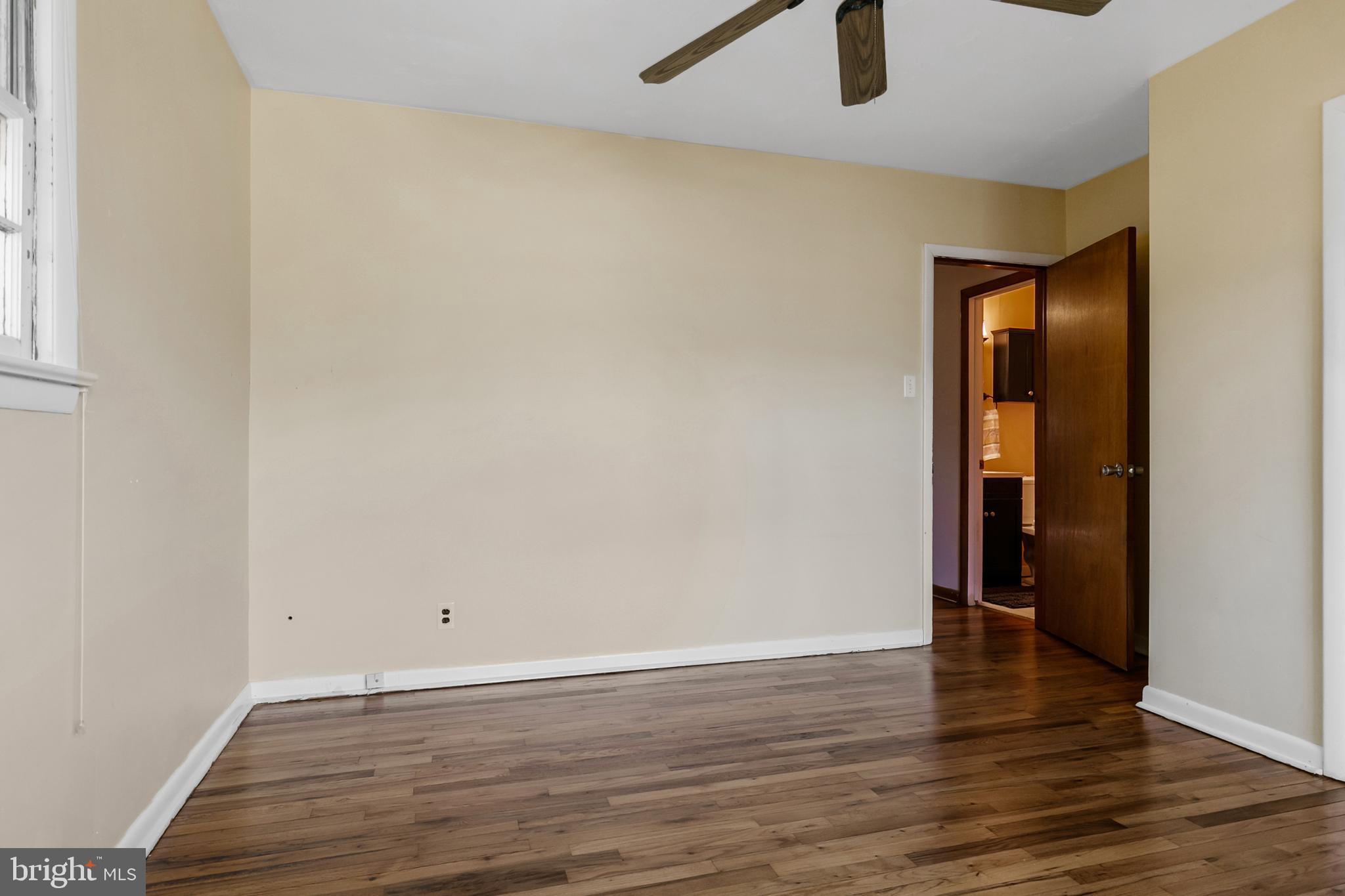 1358 Stokes Road Medford, NJ 08055 - Photo 20 of 36 an empty room with wooden floor and entrance