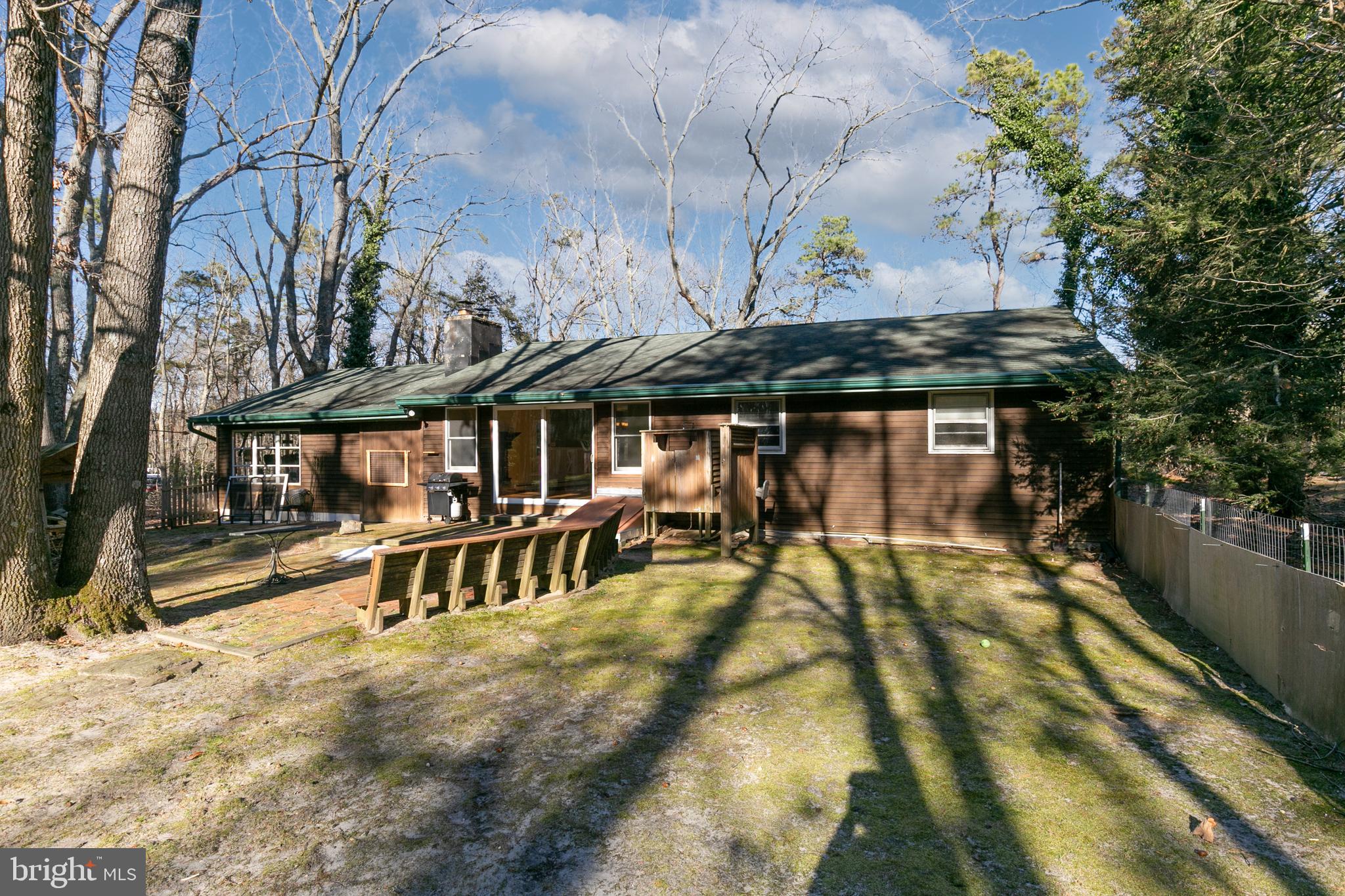 1358 Stokes Road Medford, NJ 08055 - Photo 29 of 36 a view of a patio with a table chairs and a barbeque