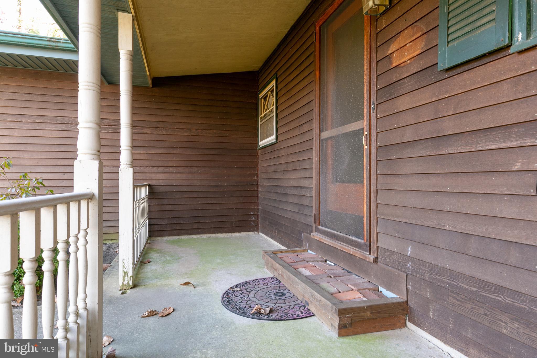 1358 Stokes Road Medford, NJ 08055 - Photo 3 of 36 a view of a porch with a door