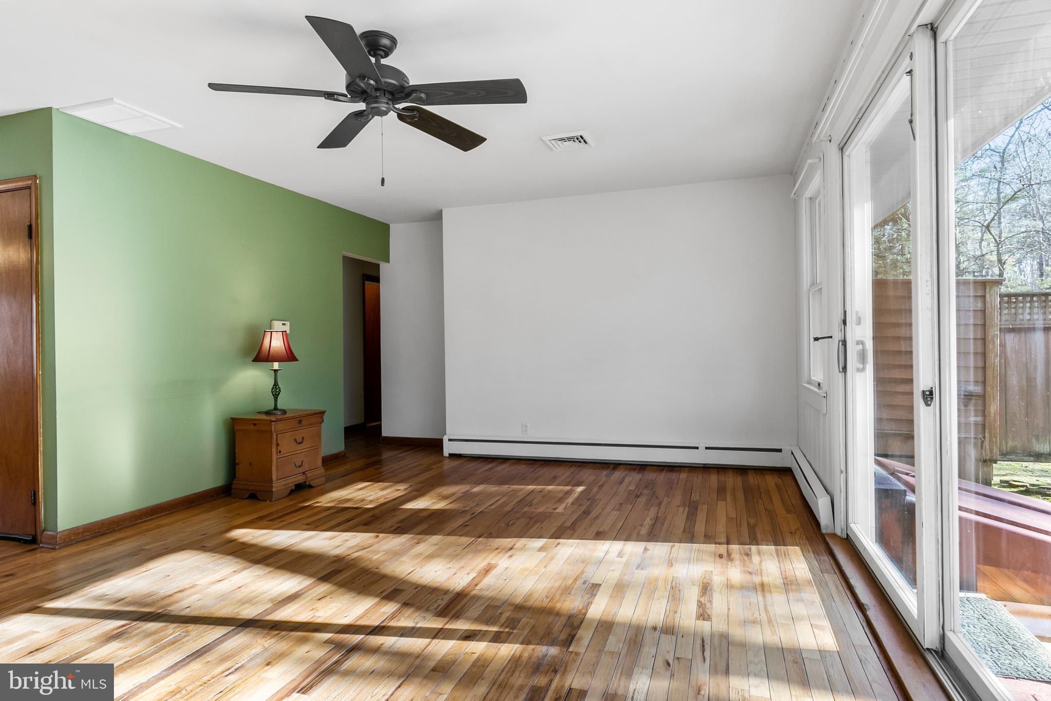 1358 Stokes Road Medford, NJ 08055 - Photo 5 of 36 a bedroom with a bed and a chandelier