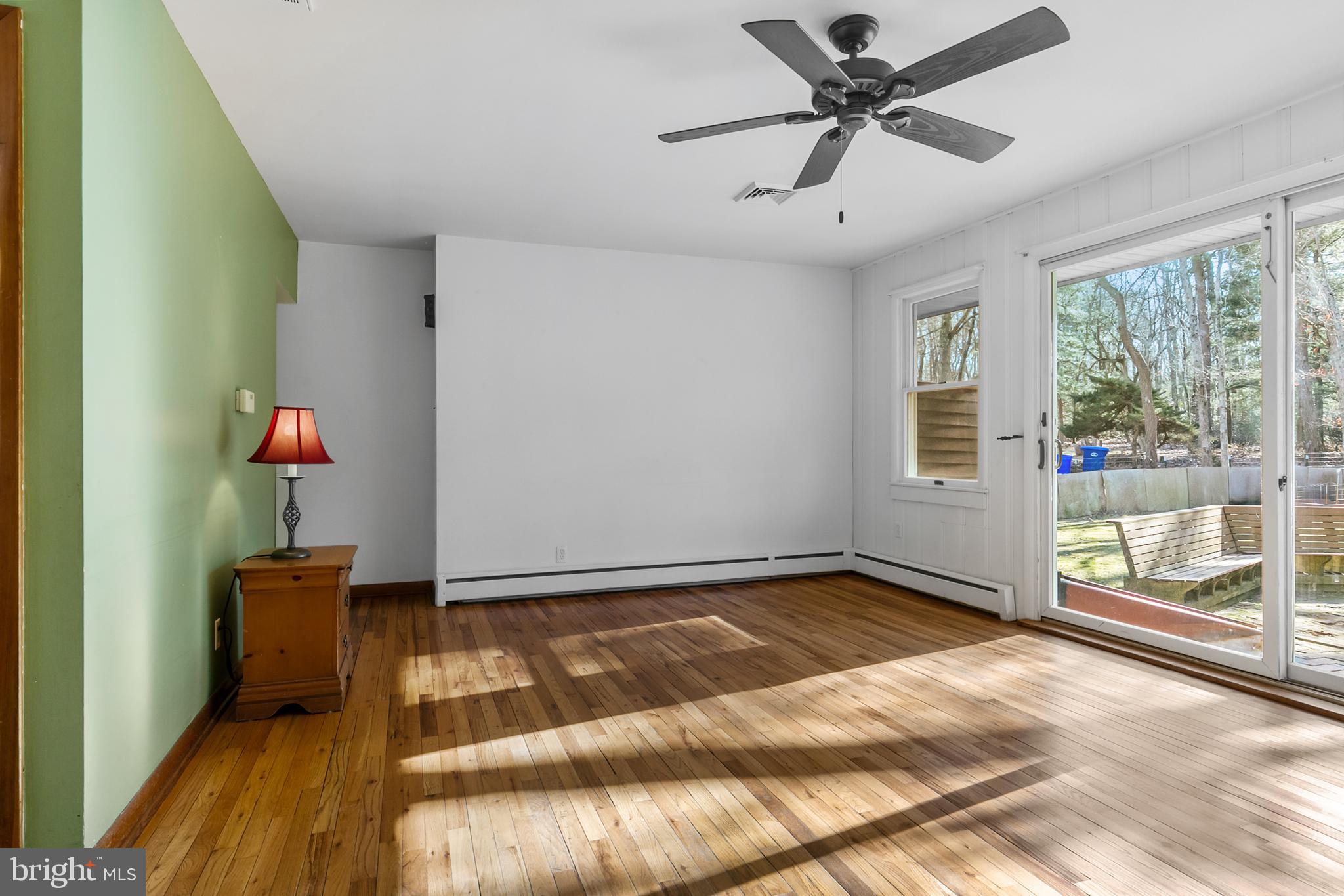 1358 Stokes Road Medford, NJ 08055 - Photo 6 of 36 a view of an empty room with a window