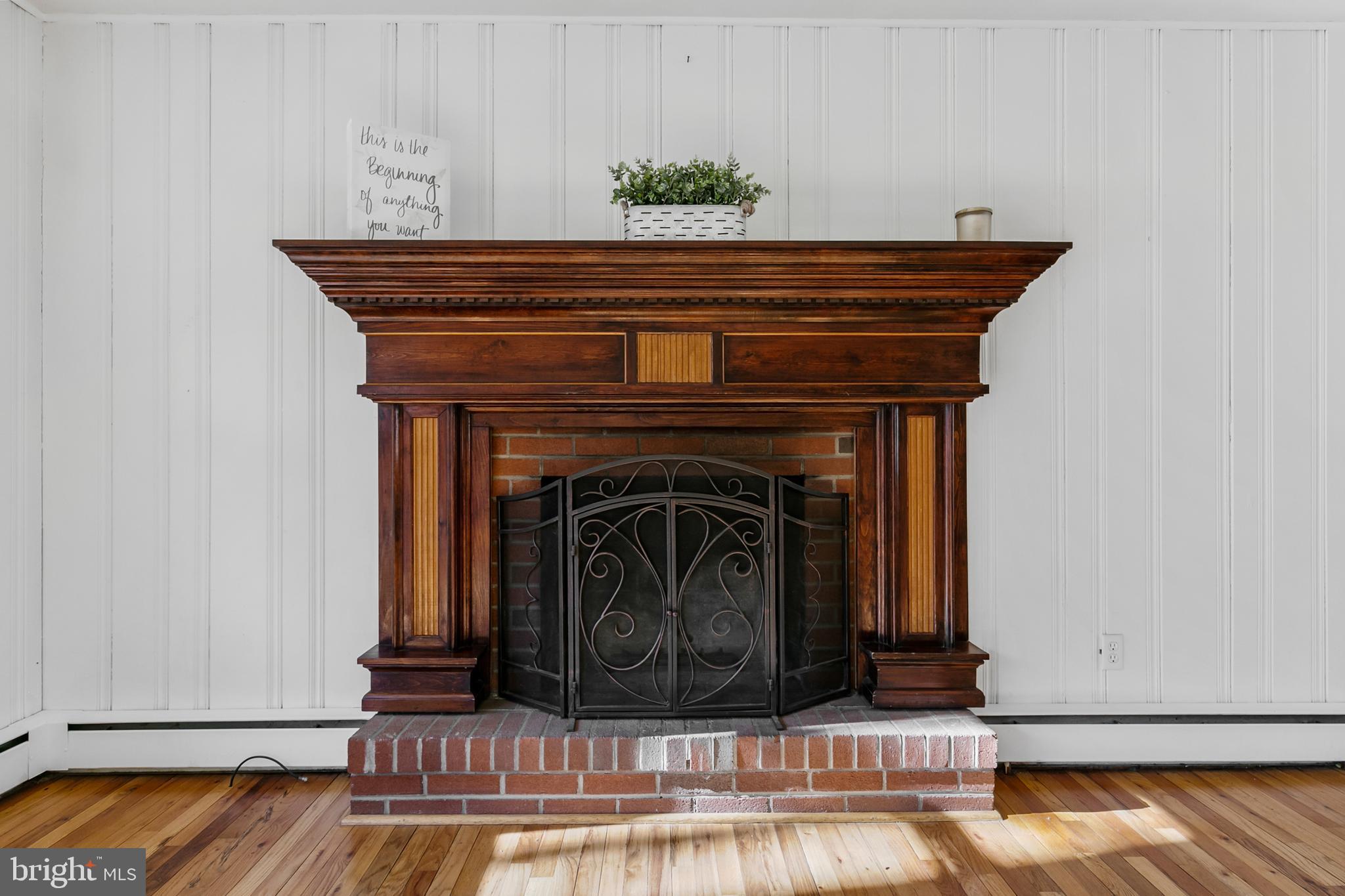 1358 Stokes Road Medford, NJ 08055 - Photo 9 of 36 a close view of a fireplace in wooden floor