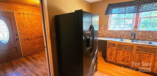 a view of a bathroom with shower curtain