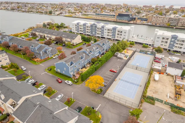 an aerial view of a city with lake view