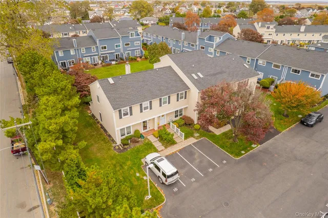 an aerial view of a house with a ocean view
