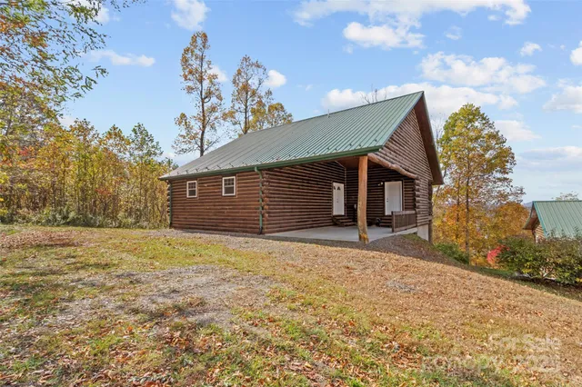 a living room with furniture and a ceiling fan