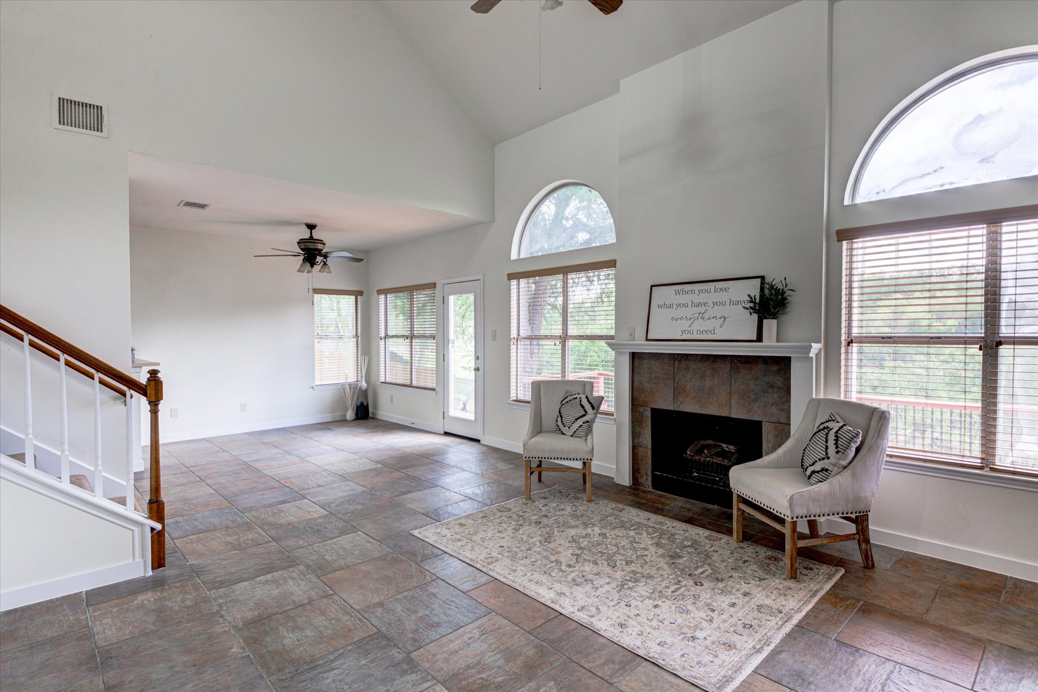 6301 Thirlmare Court Austin, TX 78754 - Photo 5 of 40 Walls of windows, with water views from every west facing room. Beautiful imported Italian commercial grade tile throughout the main floor.