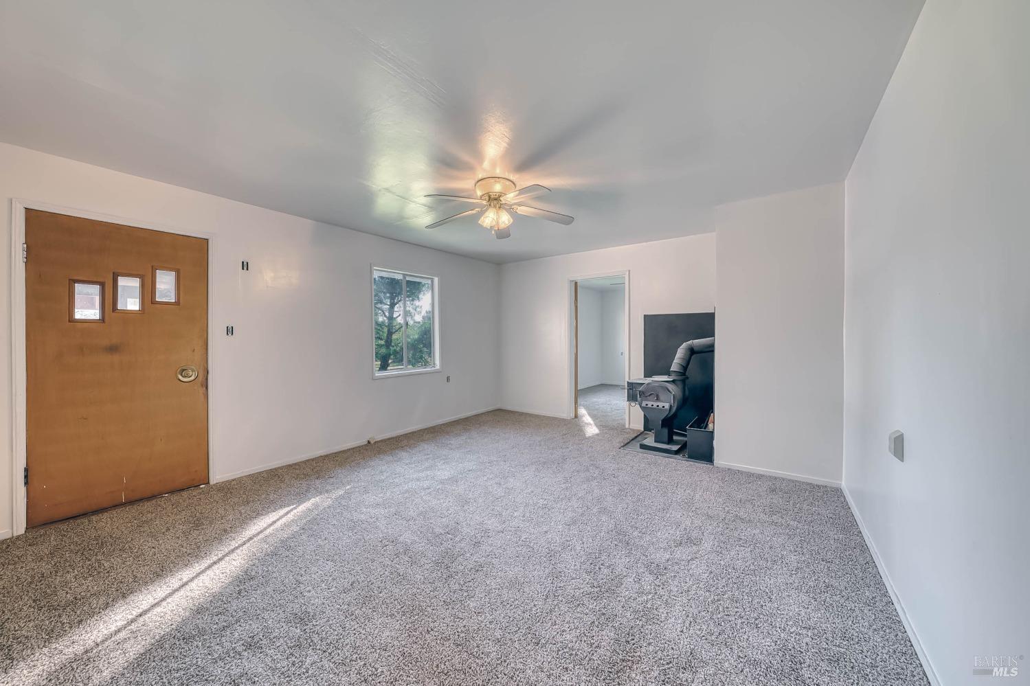 11415 Seigler Springs Road Middletown, CA 95461 - Photo 14 of 52 a view of a livingroom with a ceiling fan and window