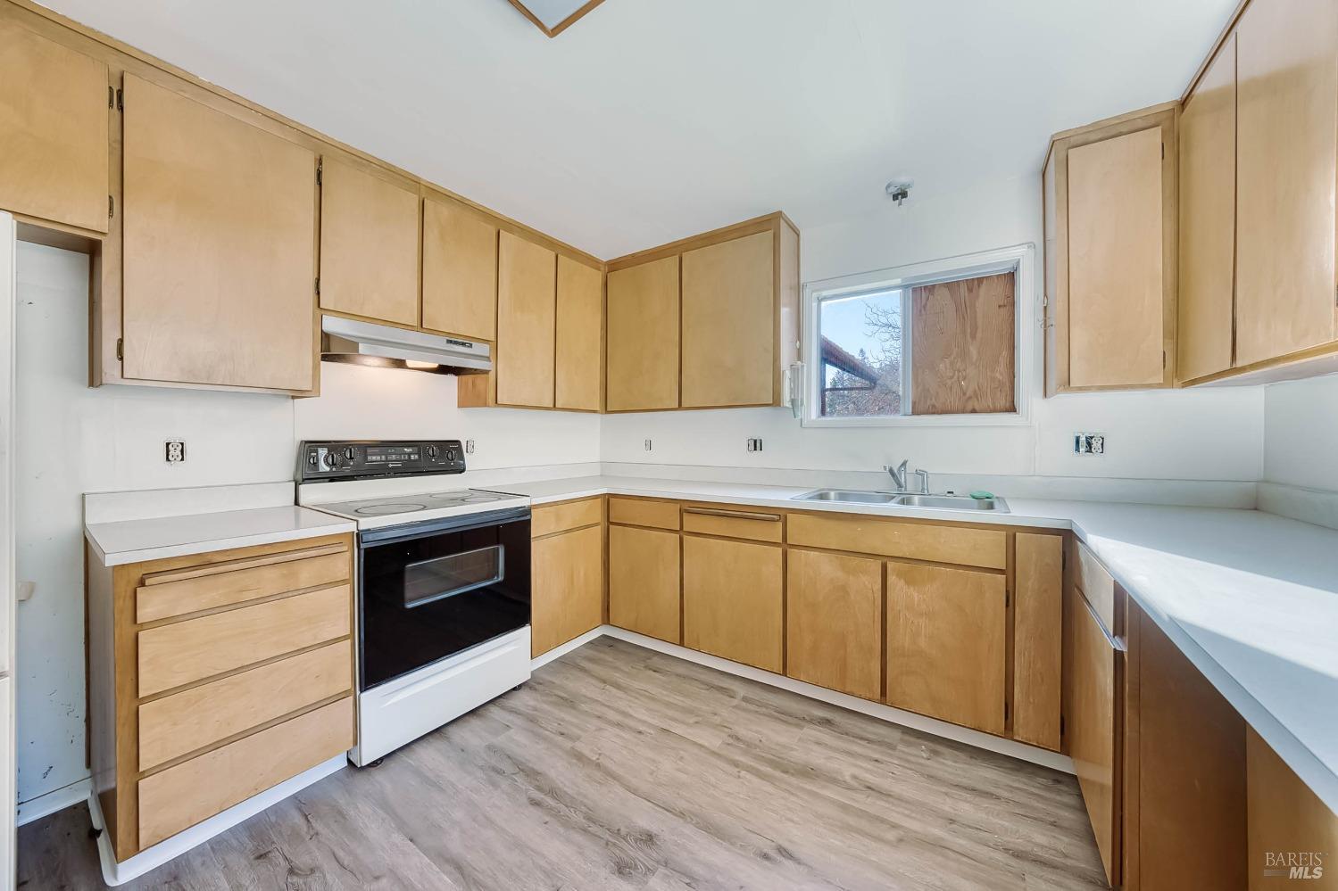 11415 Seigler Springs Road Middletown, CA 95461 - Photo 16 of 52 a kitchen with stainless steel appliances granite countertop a sink stove and cabinets