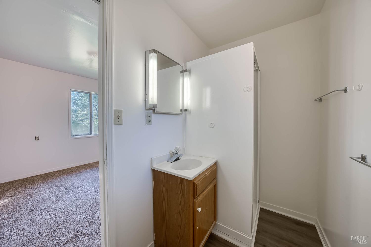 11415 Seigler Springs Road Middletown, CA 95461 - Photo 22 of 52 a bathroom with a sink and a mirror