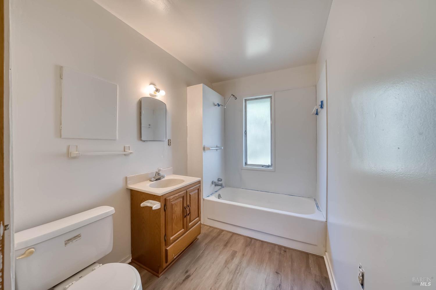 11415 Seigler Springs Road Middletown, CA 95461 - Photo 24 of 52 a bathroom with a granite countertop sink toilet and shower