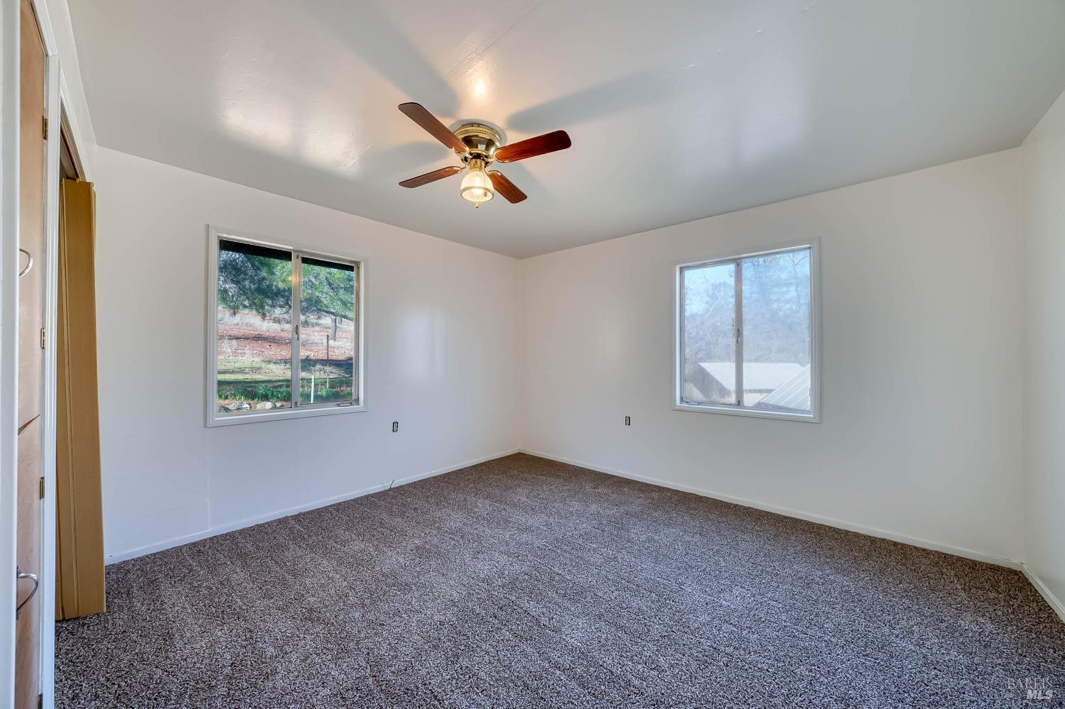 11415 Seigler Springs Road Middletown, CA 95461 - Photo 25 of 52 a view of room with window and ceiling fan
