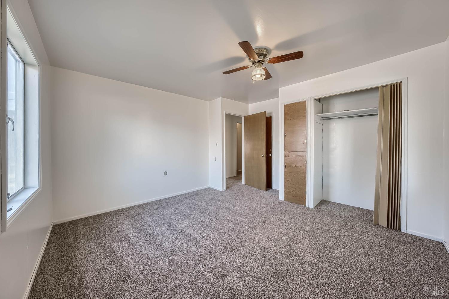 11415 Seigler Springs Road Middletown, CA 95461 - Photo 26 of 52 a view of a livingroom with a ceiling fan and window