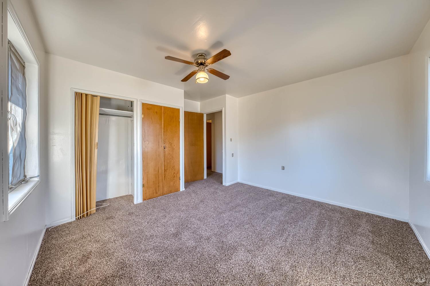 11415 Seigler Springs Road Middletown, CA 95461 - Photo 29 of 52 a view of a livingroom with a ceiling fan and window