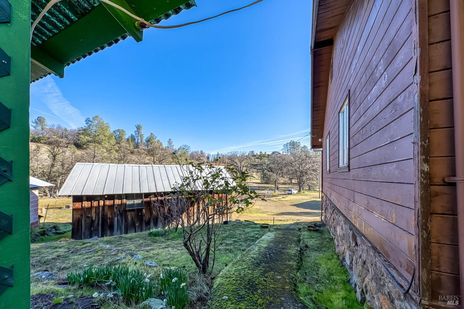11415 Seigler Springs Road Middletown, CA 95461 - Photo 32 of 52 a view of a backyard with wooden fence