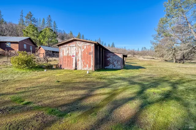 a backyard of a house with lots of green space