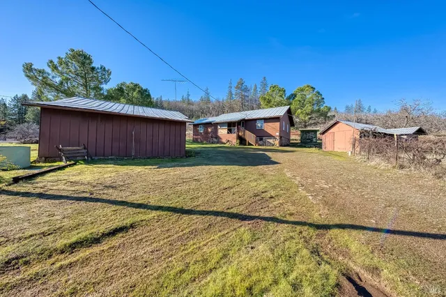a view of a house with a big yard