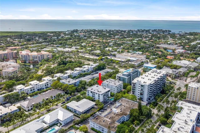 an aerial view of residential house with outdoor space and parking