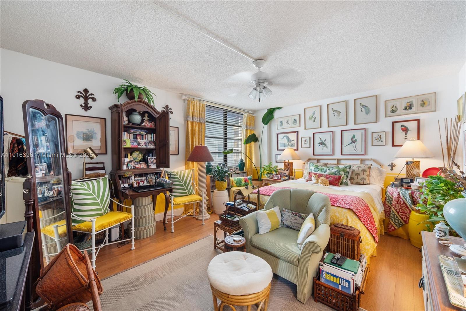 155 Sunrise Drive, Unit 4B Key Biscayne, FL 33149 - Photo 3 of 18 a living room with patio area and a couch