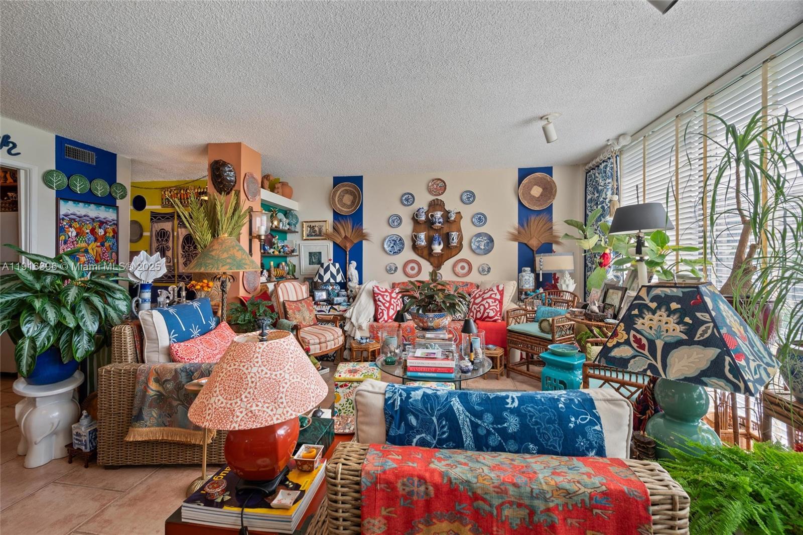 155 Sunrise Drive, Unit 4B Key Biscayne, FL 33149 - Photo 5 of 18 a room with furniture toys and a large window