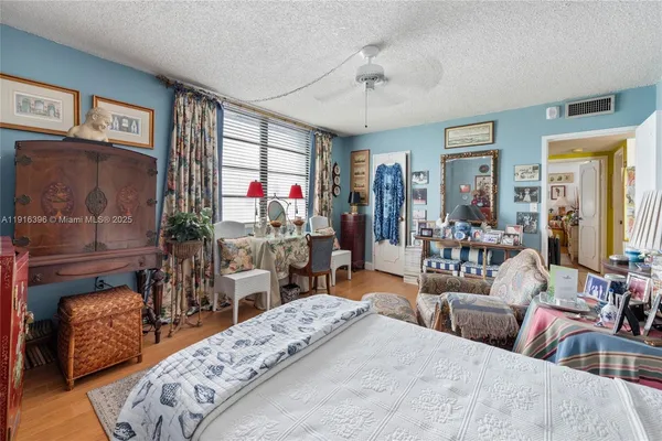 a view of walk in closet with empty room
