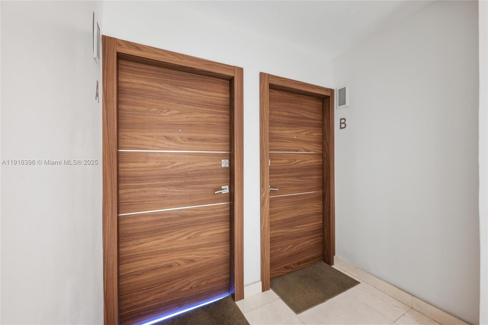 155 Sunrise Drive, Unit 4B Key Biscayne, FL 33149 - Photo 9 of 18 a view of walk in closet with empty room