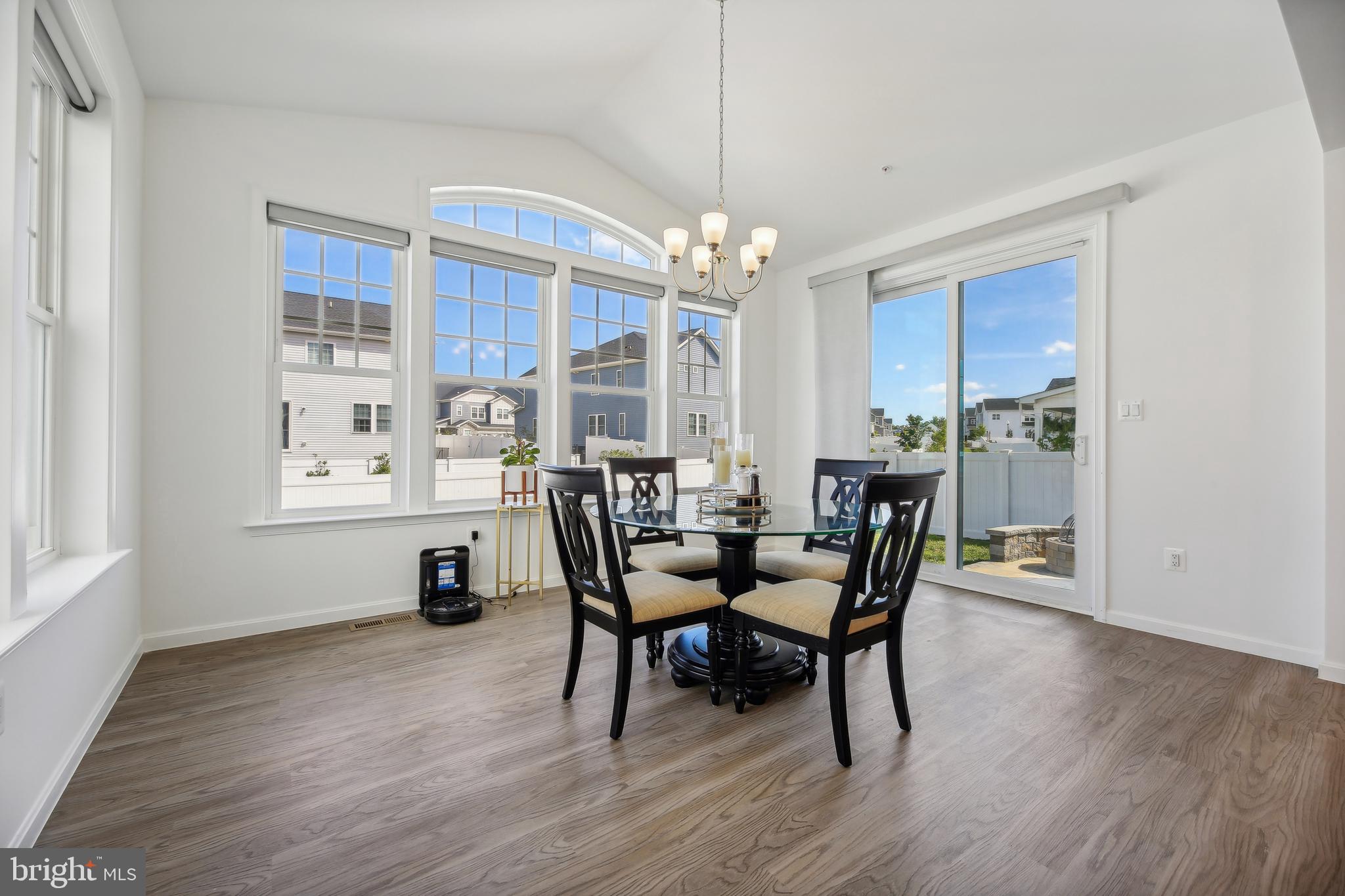 2634 Orchard Oriole Way Odenton, MD 21113 - Photo 11 of 63 a view of a dining room with furniture window and wooden floor