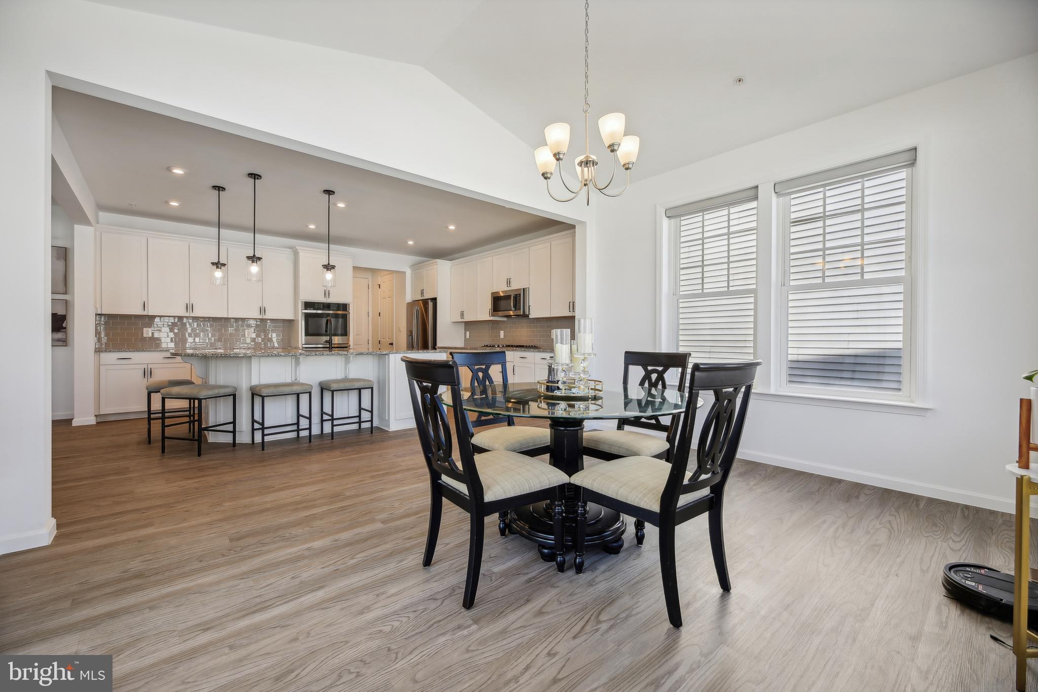 2634 Orchard Oriole Way Odenton, MD 21113 - Photo 12 of 63 a view of a dining room with furniture and chandelier
