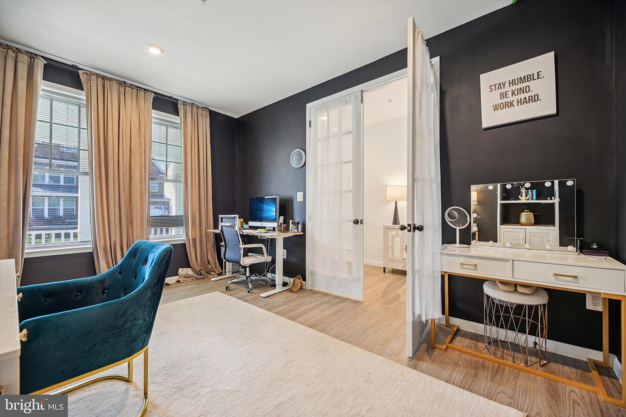 2634 Orchard Oriole Way Odenton, MD 21113 - Photo 19 of 63 a living room with furniture a dining table and a flat screen tv