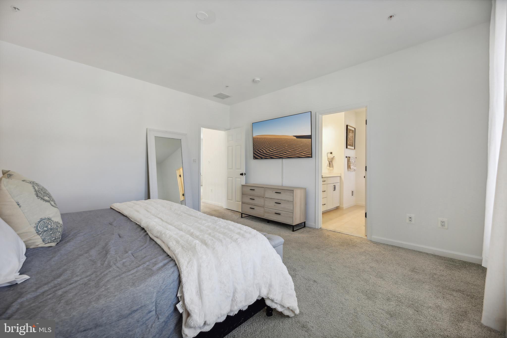 2634 Orchard Oriole Way Odenton, MD 21113 - Photo 21 of 63 a bedroom with a bed and a flat screen tv