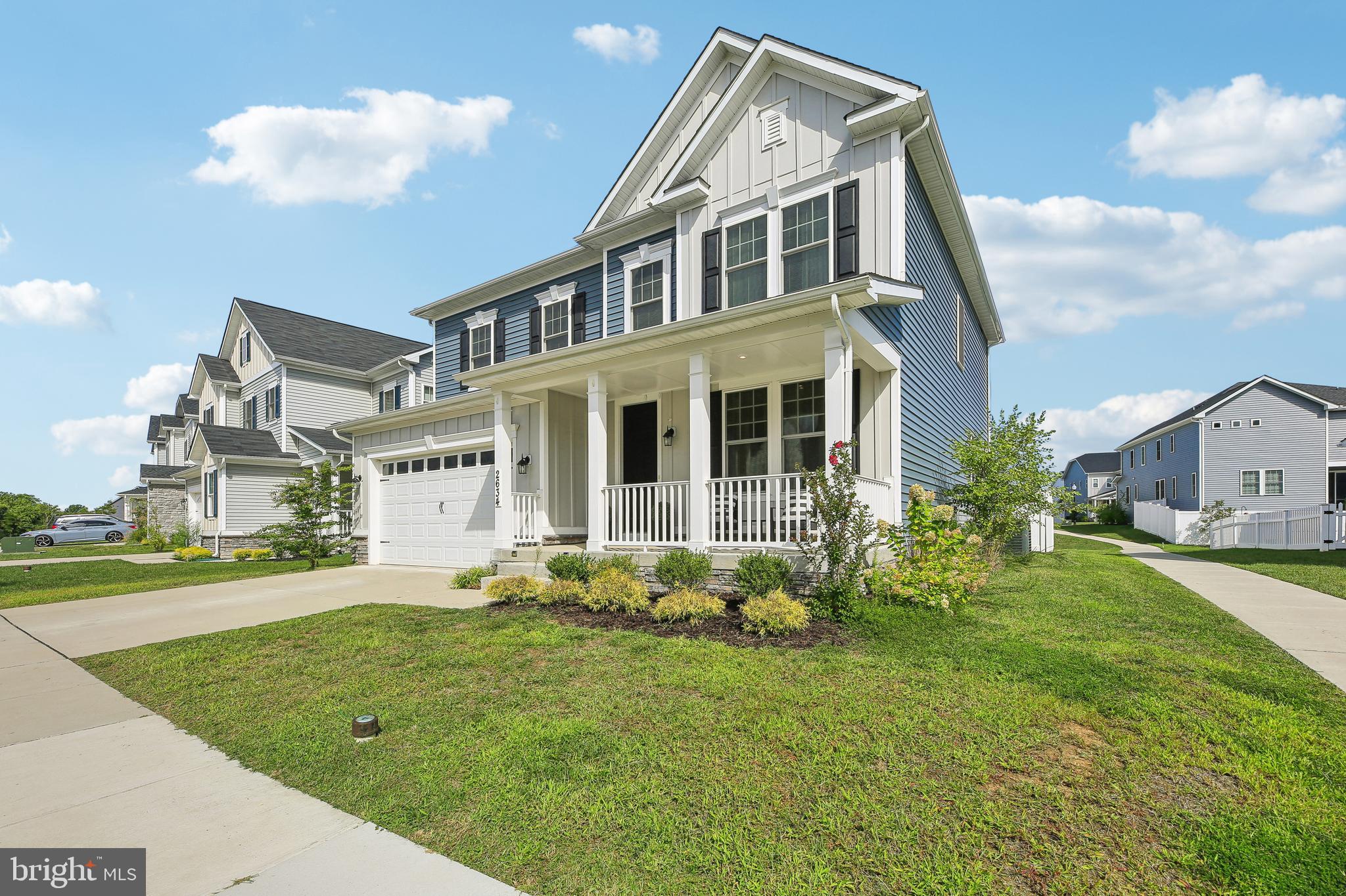 2634 Orchard Oriole Way Odenton, MD 21113 - Photo 3 of 63 a front view of a house with a yard