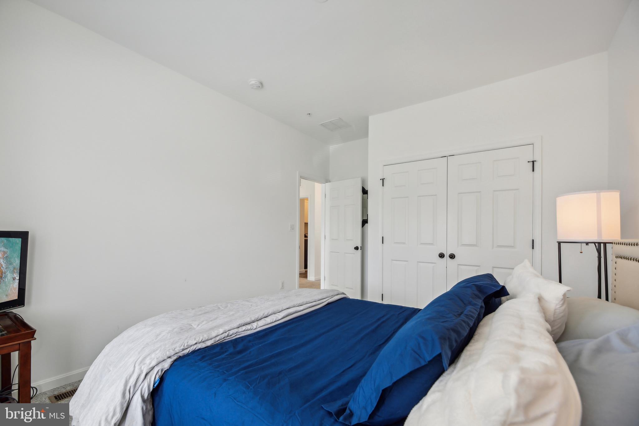 2634 Orchard Oriole Way Odenton, MD 21113 - Photo 33 of 63 a bed room with a bed and a lamp