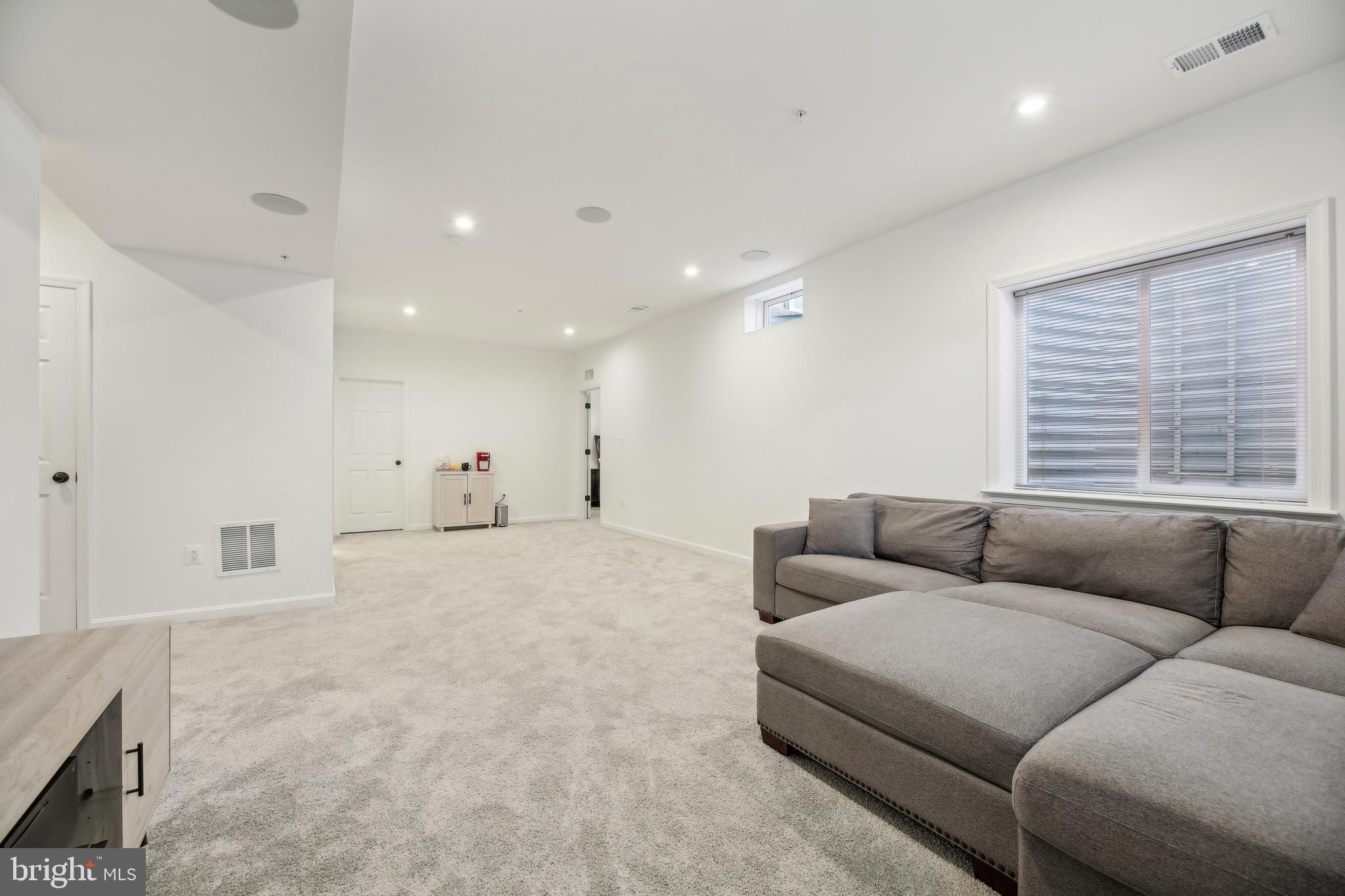 2634 Orchard Oriole Way Odenton, MD 21113 - Photo 36 of 63 a living room with furniture and a large window