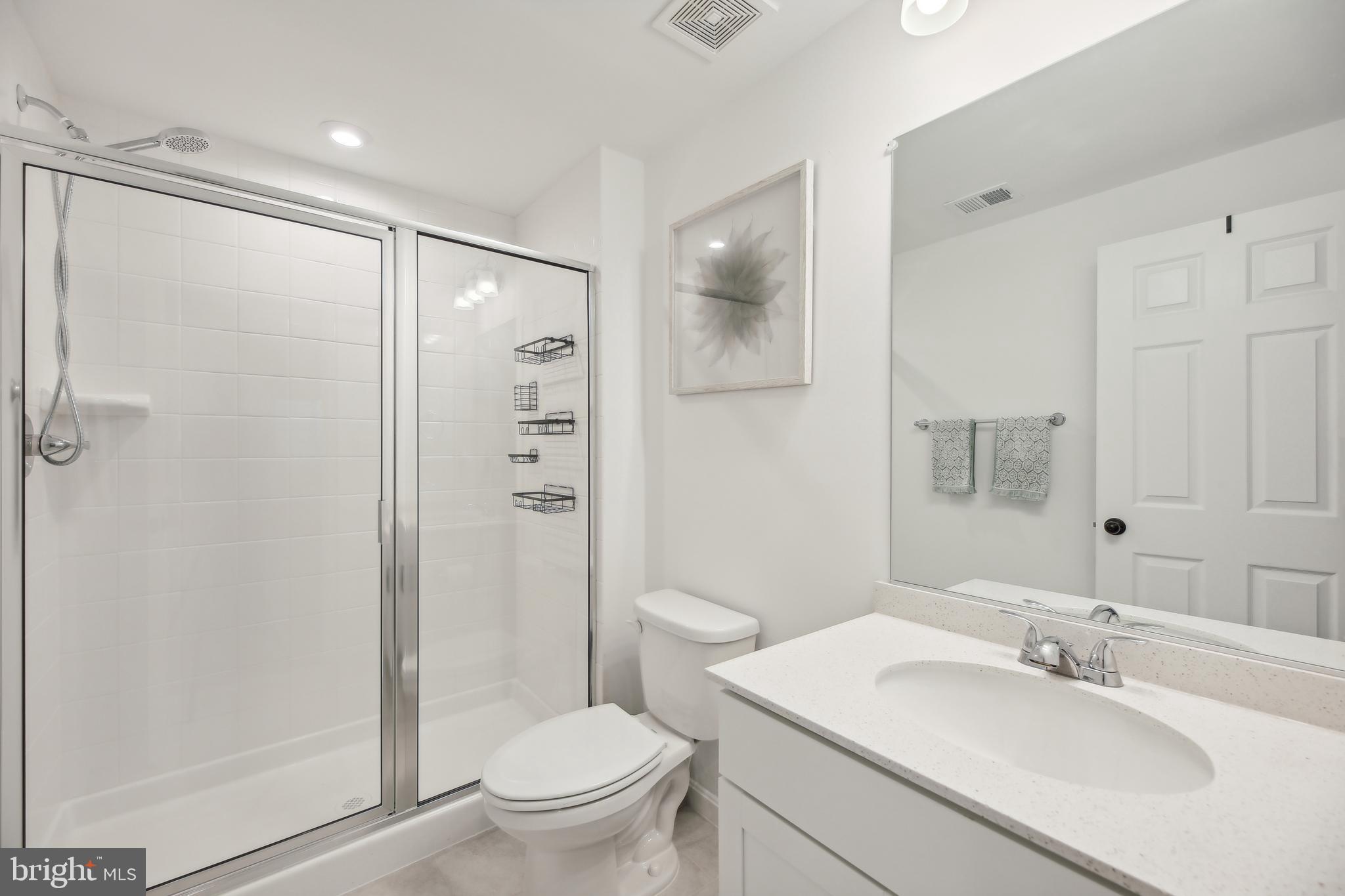 2634 Orchard Oriole Way Odenton, MD 21113 - Photo 39 of 63 a bathroom with a sink toilet and shower