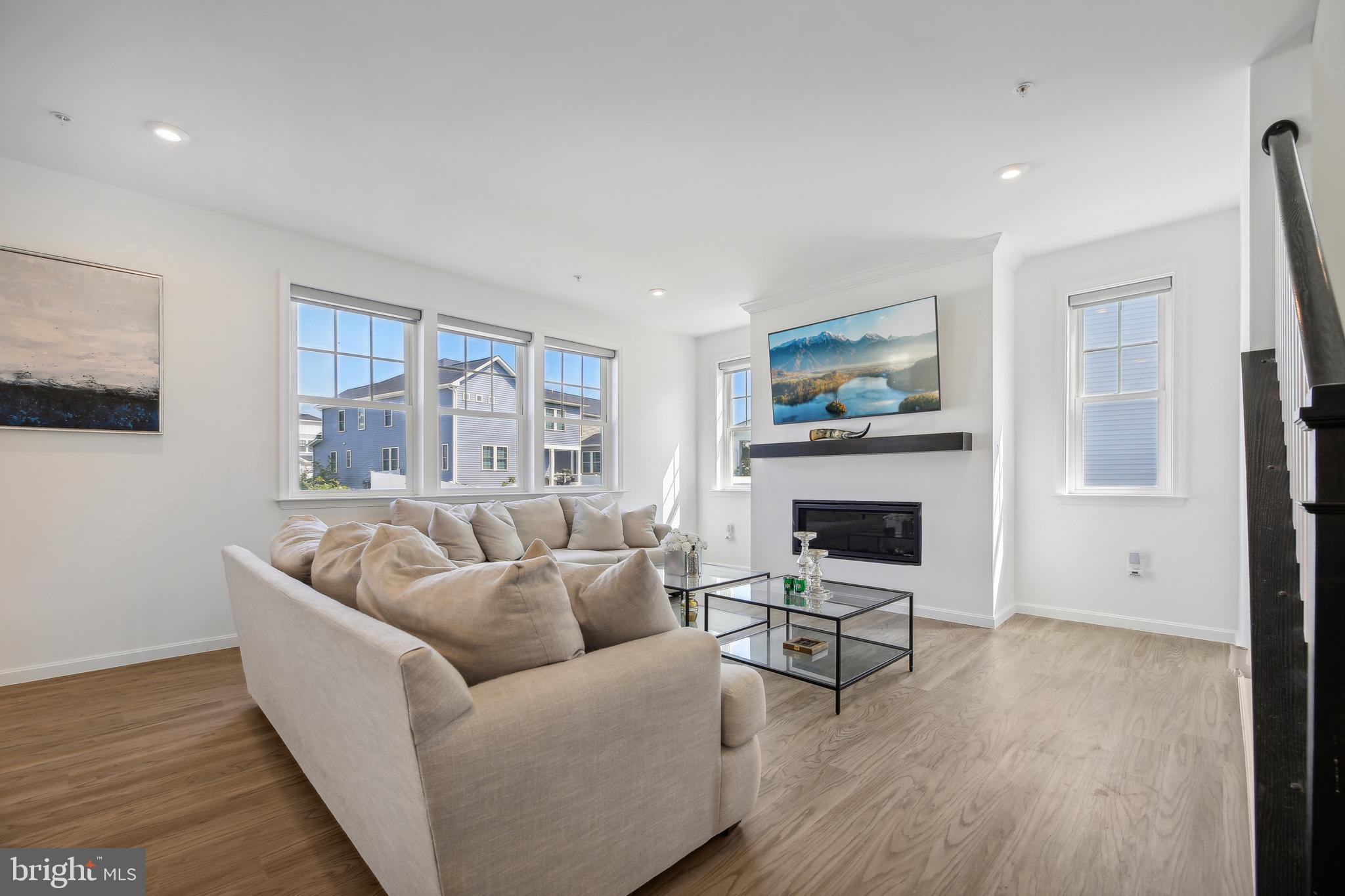 2634 Orchard Oriole Way Odenton, MD 21113 - Photo 7 of 63 a living room with furniture and a fireplace