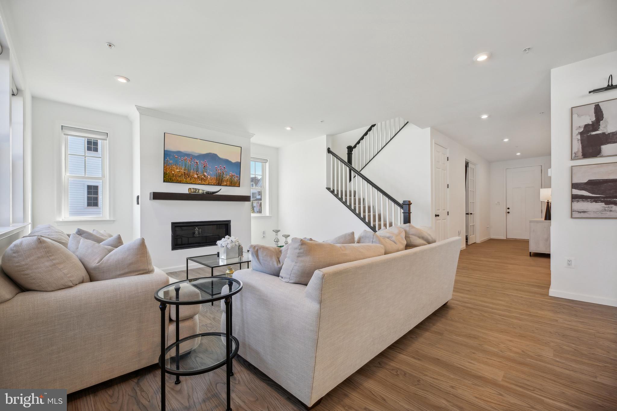 2634 Orchard Oriole Way Odenton, MD 21113 - Photo 10 of 63 a living room with furniture and a fireplace