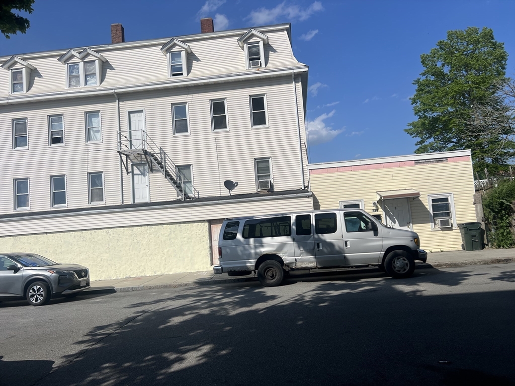 123 Multi Family Way Fall River, MA 02724 - Photo 3 of 7 a car parked on the side of a street