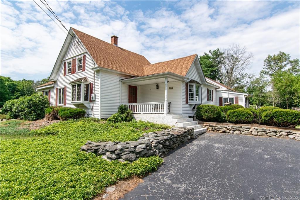 381 North Windham Road Windham, CT 06256 - Photo 1 of 1 a front view of a house with a garden