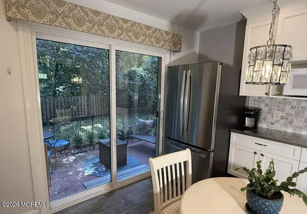 a view of kitchen with furniture and a potted plant