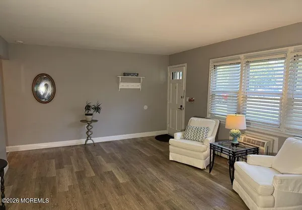 a view of a livingroom with furniture and wooden floor
