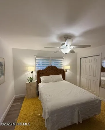 a bedroom with a bed and a lamp with window