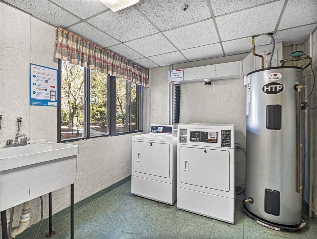 9 Broadway, Unit 110 Saugus, MA 01906 - Photo 19 of 27 a utility room with dryer and washer