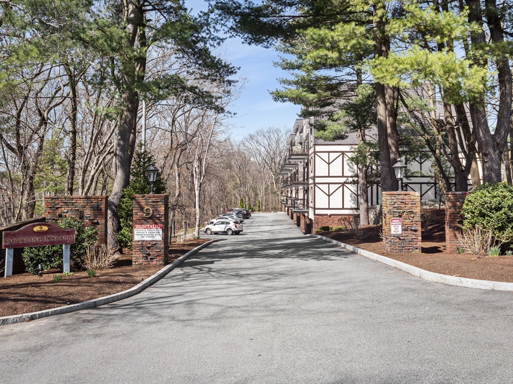 9 Broadway, Unit 110 Saugus, MA 01906 - Photo 2 of 27 a view of a street with houses