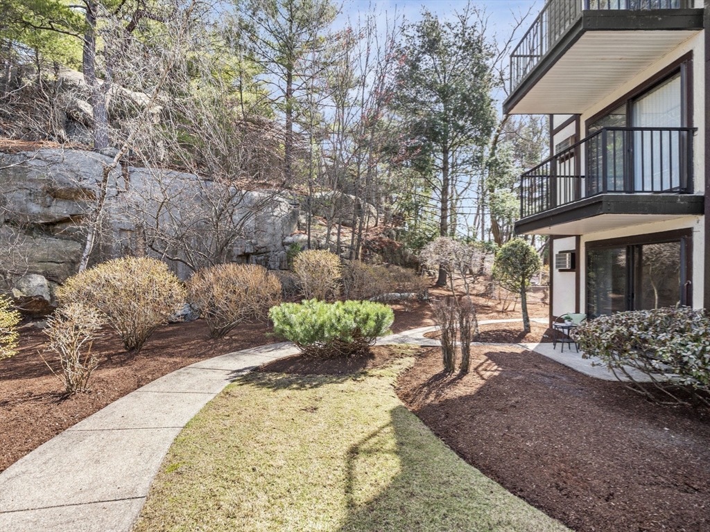 9 Broadway, Unit 110 Saugus, MA 01906 - Photo 23 of 27 a view of a house with backyard and sitting area