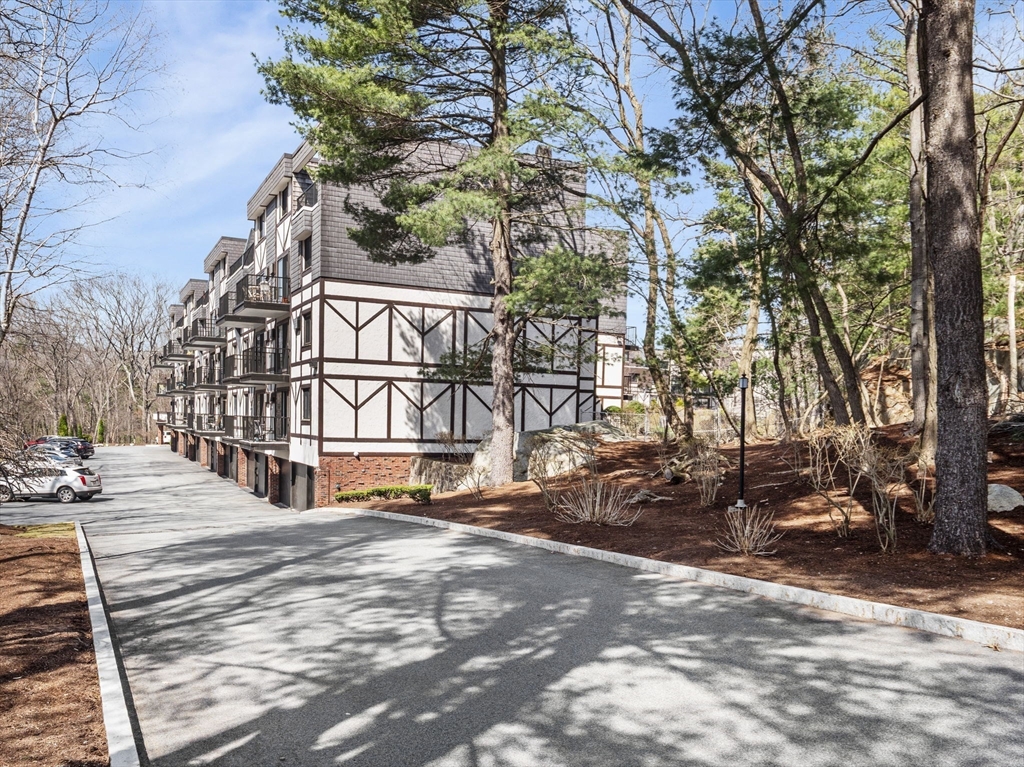 9 Broadway, Unit 110 Saugus, MA 01906 - Photo 3 of 27 a view of a street with houses